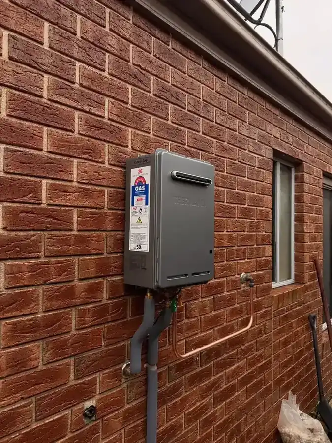 Thermann continuous flow gas hot water unit mounted on an external wall