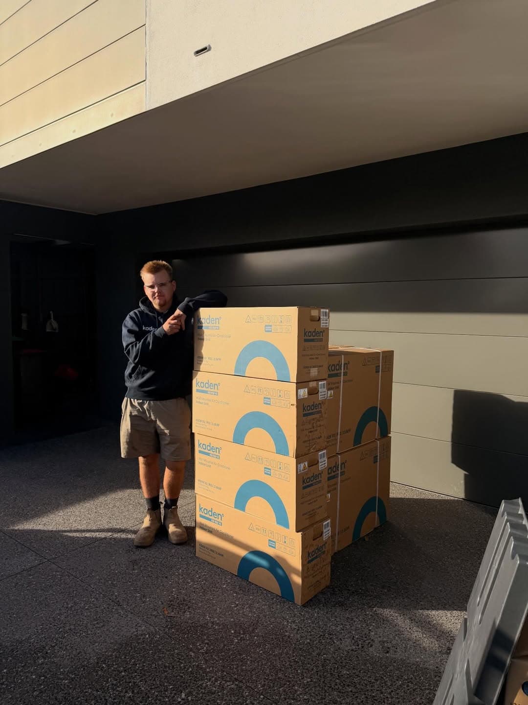 An Advanced Gas installer unboxing a new Kaden system before fitting