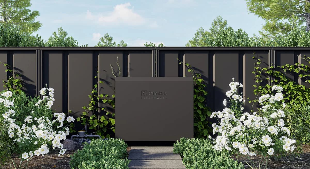 Puretec Filterwall whole-house filtration enclosure mounted on a fence