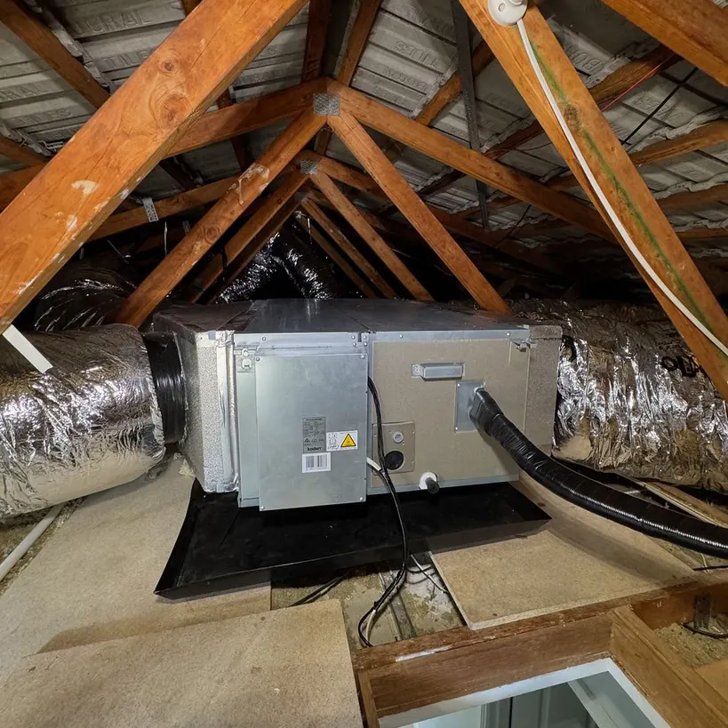 Ducted split system indoor unit installed in a ceiling cavity
