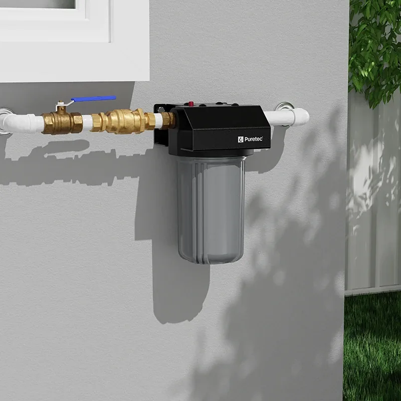 Puretec inline filter plumbed into a wall with brass isolation valves