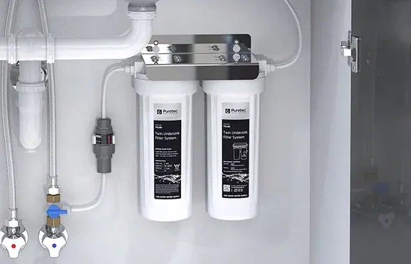 The twin cartridges, bracket and isolation valve under the sink
