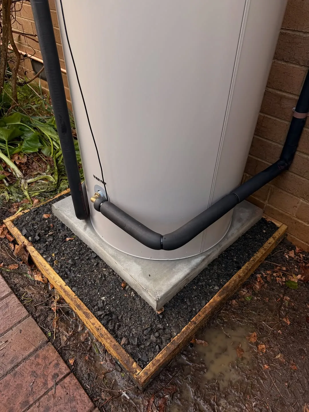 Reclaim CO₂ split heat pump outdoor unit close up on a finished install